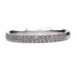 A PLATINUM DIAMOND HALF HOOP RING