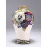 A WILLIAM MOORCROFT 'PANSY' PATTERN POTTERY VASE