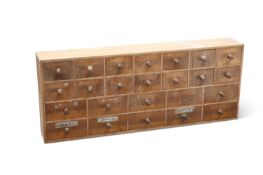 A PINE BANK OF DRAWERS