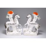 A PAIR OF VICTORIAN STAFFORDSHIRE POTTERY ZEBRA SPILL VASES