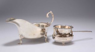 A GEORGE V SILVER SAUCE BOAT, AND A FOREIGN SILVER TEA STRAINER