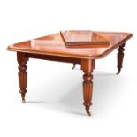 A VICTORIAN MAHOGANY WIND-OUT EXTENDING DINING TABLE