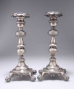 A PAIR OF 18TH CENTURY CONTINENTAL CAST SILVER CANDLESTICKS