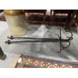A PAIR OF VICTORIAN IRON ADJUSTABLE GAME/JACK HOOKS