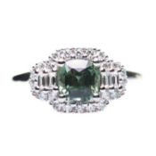 A PLATINUM GREEN SAPPHIRE AND DIAMOND CLUSTER RING