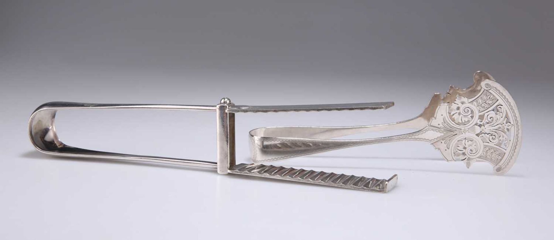 A PAIR OF VICTORIAN CRISTOFLE SILVER-PLATED ASPARAGUS TONGS AND A PAIR OF PIERCED BRIGHT-CUT TONGS - Image 2 of 2