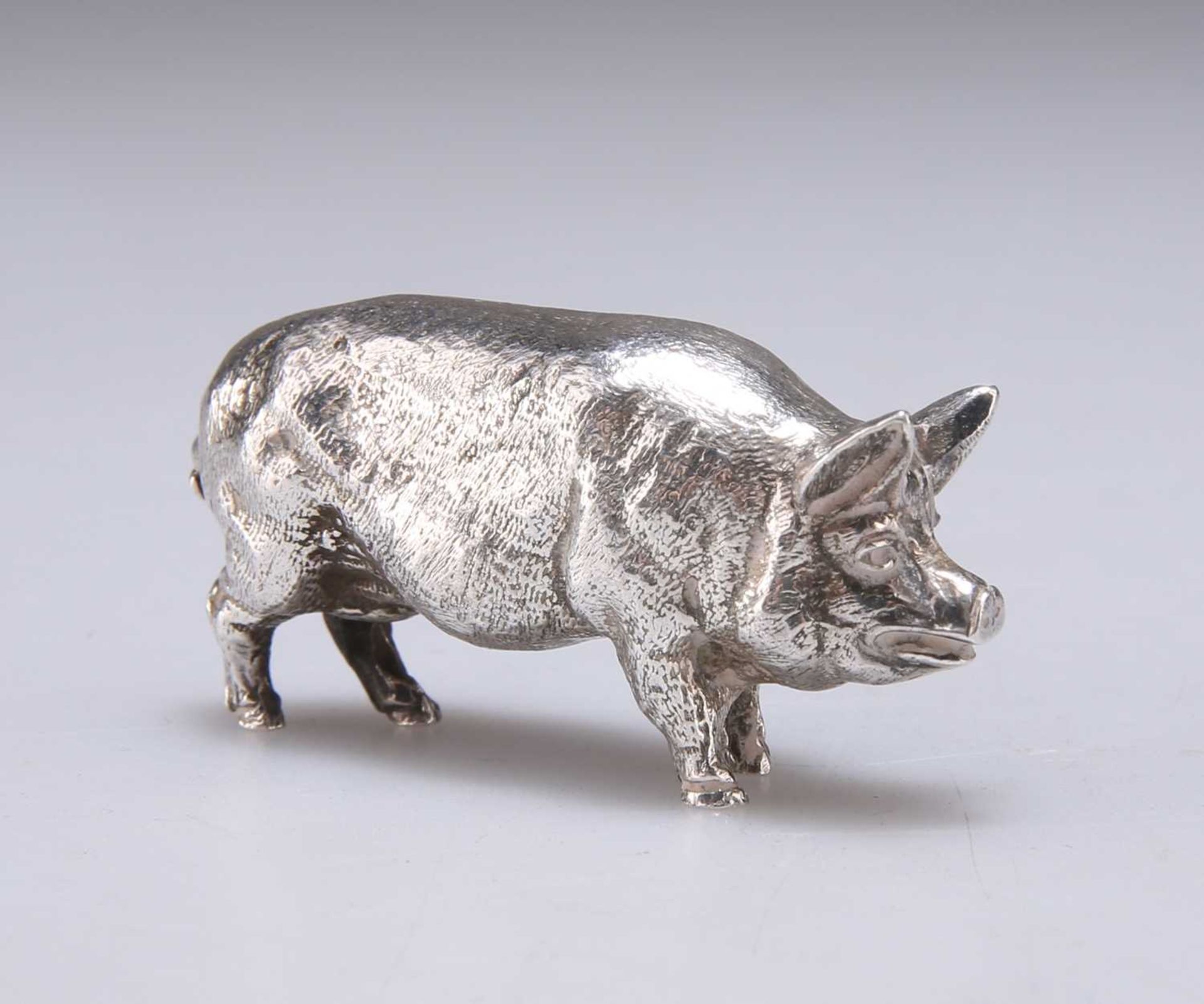 A CONTINENTAL CAST SILVER MODEL OF A PIG