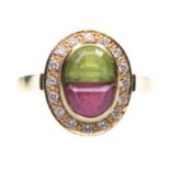 AN 18 CARAT GOLD PERIDOT, PINK TOURMALINE AND DIAMOND CLUSTER RING