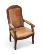 A CARVED AND STAINED BEECH LEATHER UPHOLSTERED CHILD'S ARMCHAIR