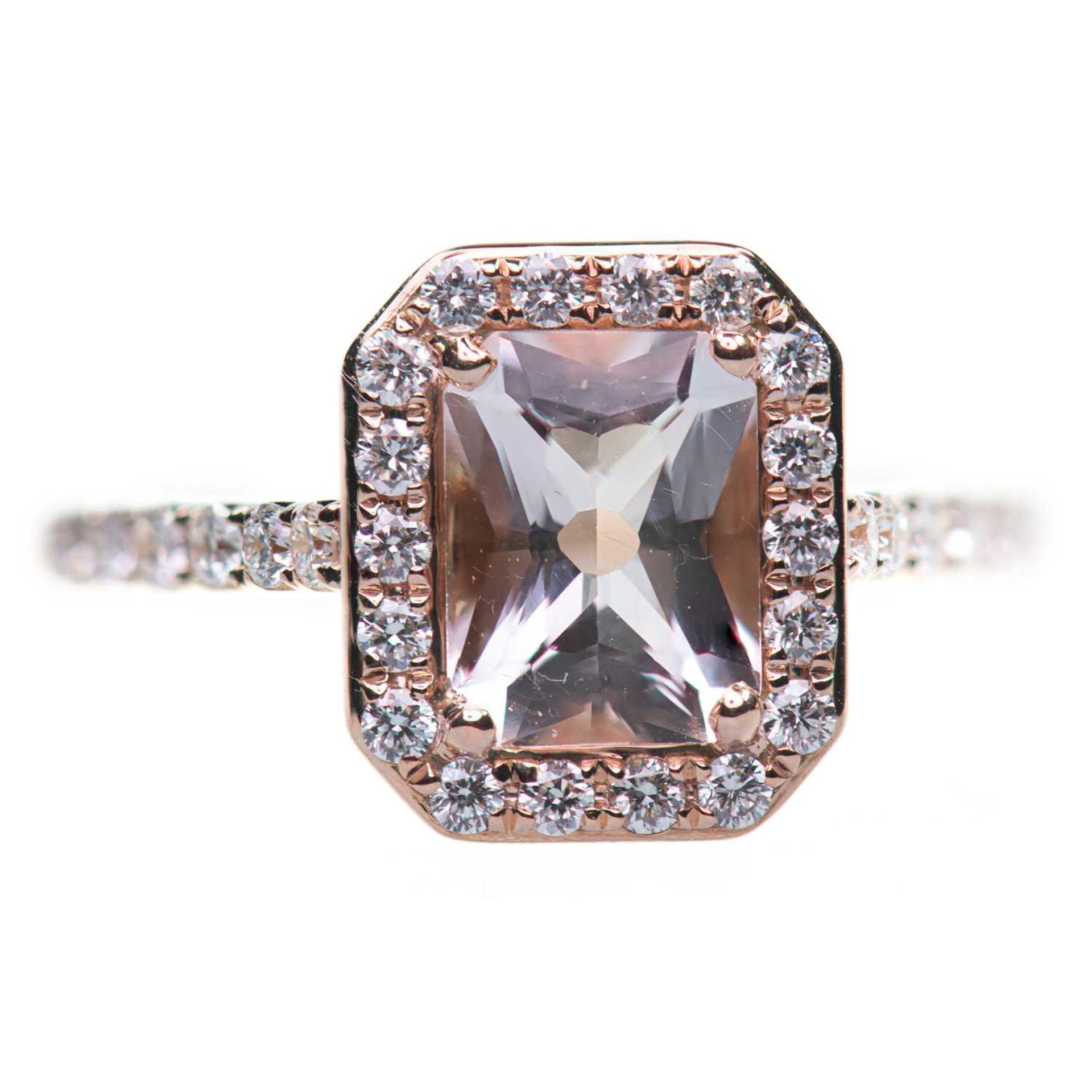 AN 18 CARAT ROSE GOLD MORGANITE AND DIAMOND CLUSTER RING
