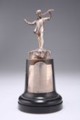 A GEORGE VI SILVER FIGURE OF A BOY PLAYING THE PIPES
