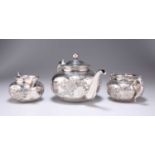 A CHINESE SILVER THREE-PIECE TEA SERVICE