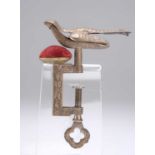 A VICTORIAN GILT-METAL HEMMING BIRD SEWING CLAMP