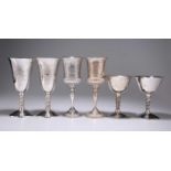 THREE PAIRS OF SILVER-PLATED GOBLETS