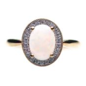 AN 18 CARAT GOLD OPAL AND DIAMOND CLUSTER RING