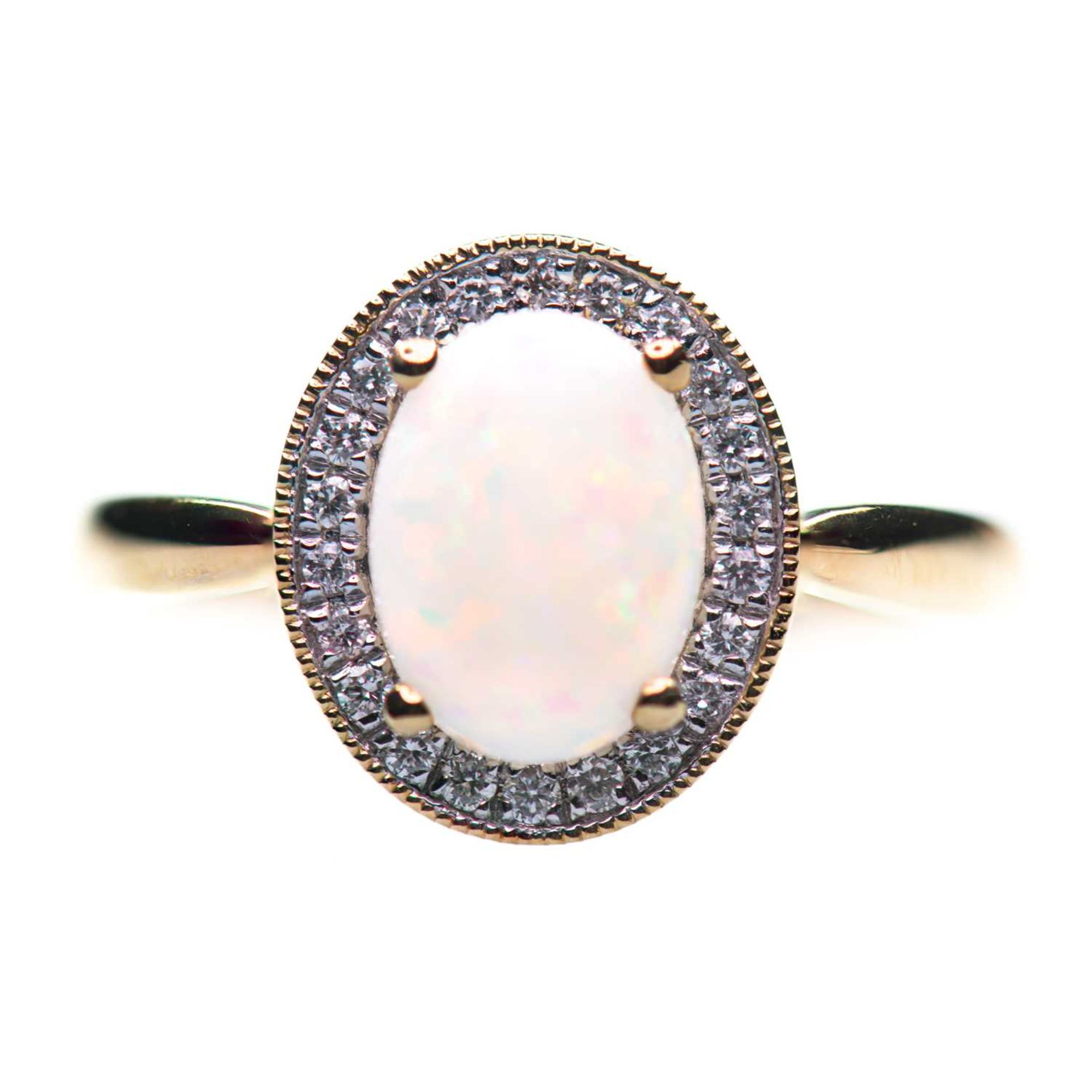 AN 18 CARAT GOLD OPAL AND DIAMOND CLUSTER RING