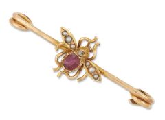 A LATE VICTORIAN RUBY, DIAMOND AND SEED PEARL INSECT BAR BROOCH