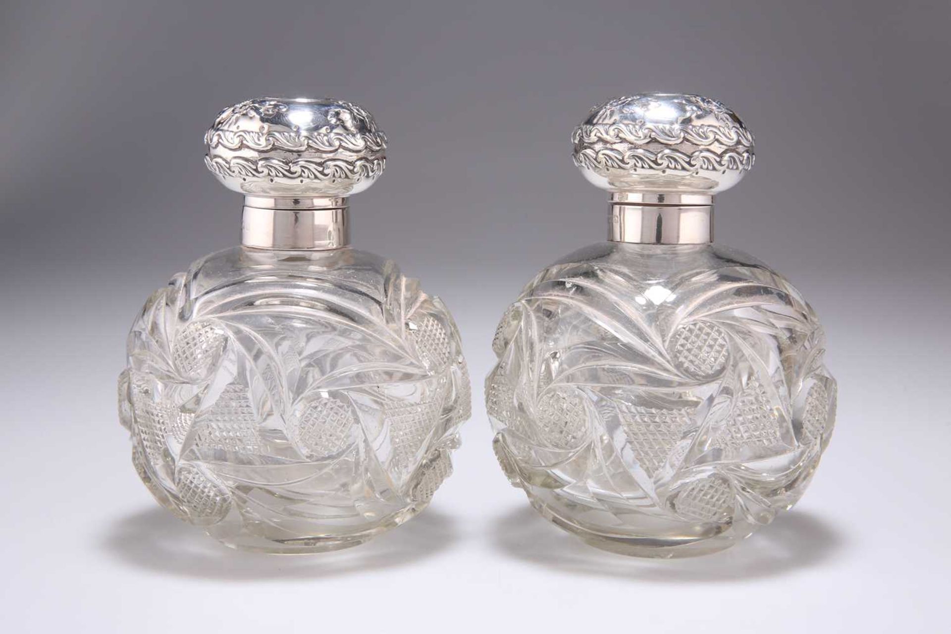 A PAIR OF EDWARDIAN SILVER-MOUNTED DRESSING TABLE JARS