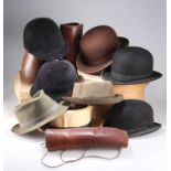 A MIXED LOT OF LEATHER GAITERS, BOWLER HATS AND OTHER HEADWEAR
