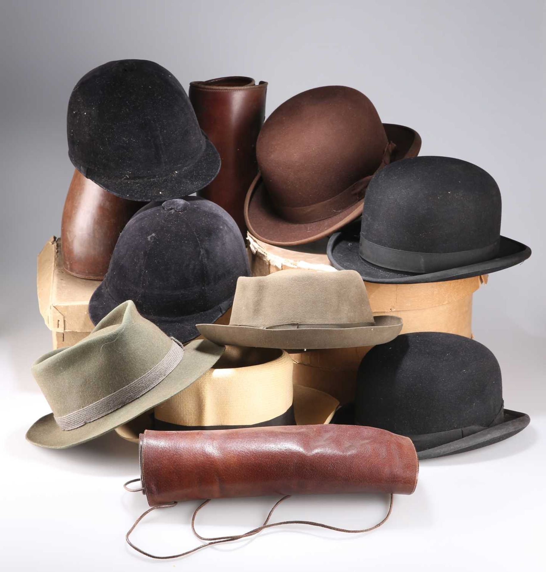 A MIXED LOT OF LEATHER GAITERS, BOWLER HATS AND OTHER HEADWEAR