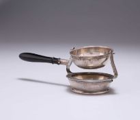 AN EDWARDIAN SILVER TEA STRAINER ON STAND