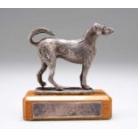 AN ELIZABETH II CAST SILVER MODEL OF A DOG