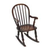 A 19TH CENTURY ELM AND OAK CHILD'S WINDSOR ROCKING CHAIR