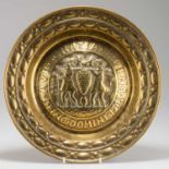 A 16TH CENTURY STYLE BRASS ALMS DISH, 19TH CENTURY