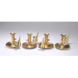 A SET OF FOUR 19TH CENTURY BRASS PUSH-UP CHAMBERSTICKS