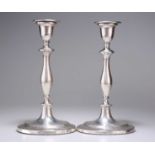 A PAIR OF GEORGE III SILVER CANDLESTICKS