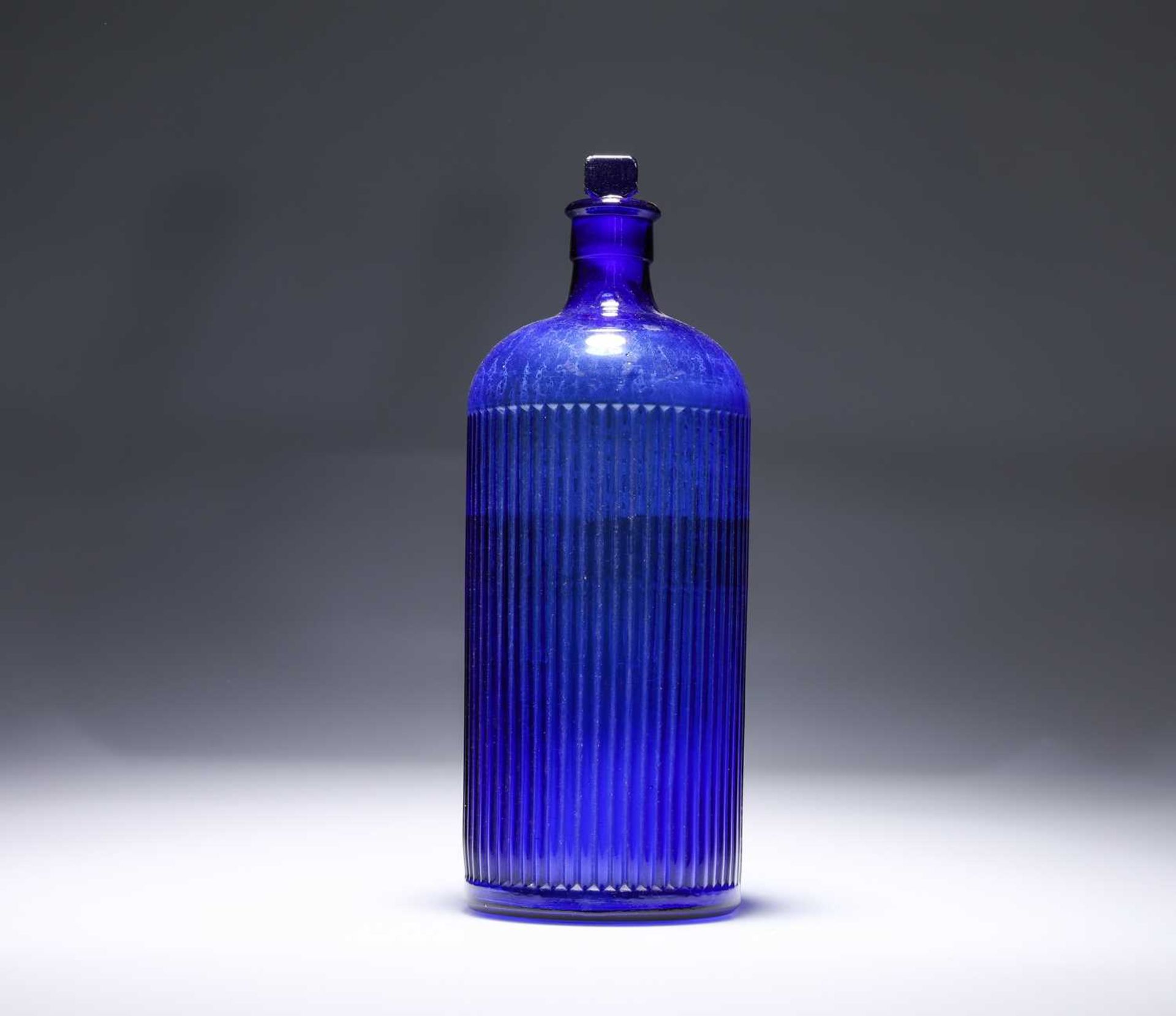 A VICTORIAN COBALT BLUE GLASS POISON BOTTLE