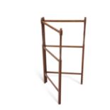 A 19TH CENTURY STAINED PINE FOLDING TOWEL RAIL