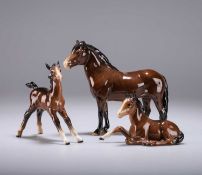 A BESWICK MODEL OF AN EXMOOR PONY AND TWO BESWICK MODELS OF FOALS