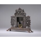 A VICTORIAN CAST IRON MINIATURE FIRE SURROUND