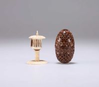 A 19TH CENTURY COQUILLA NUT POMANDER AND A 19TH CENTURY BONE TAPE MEASURE