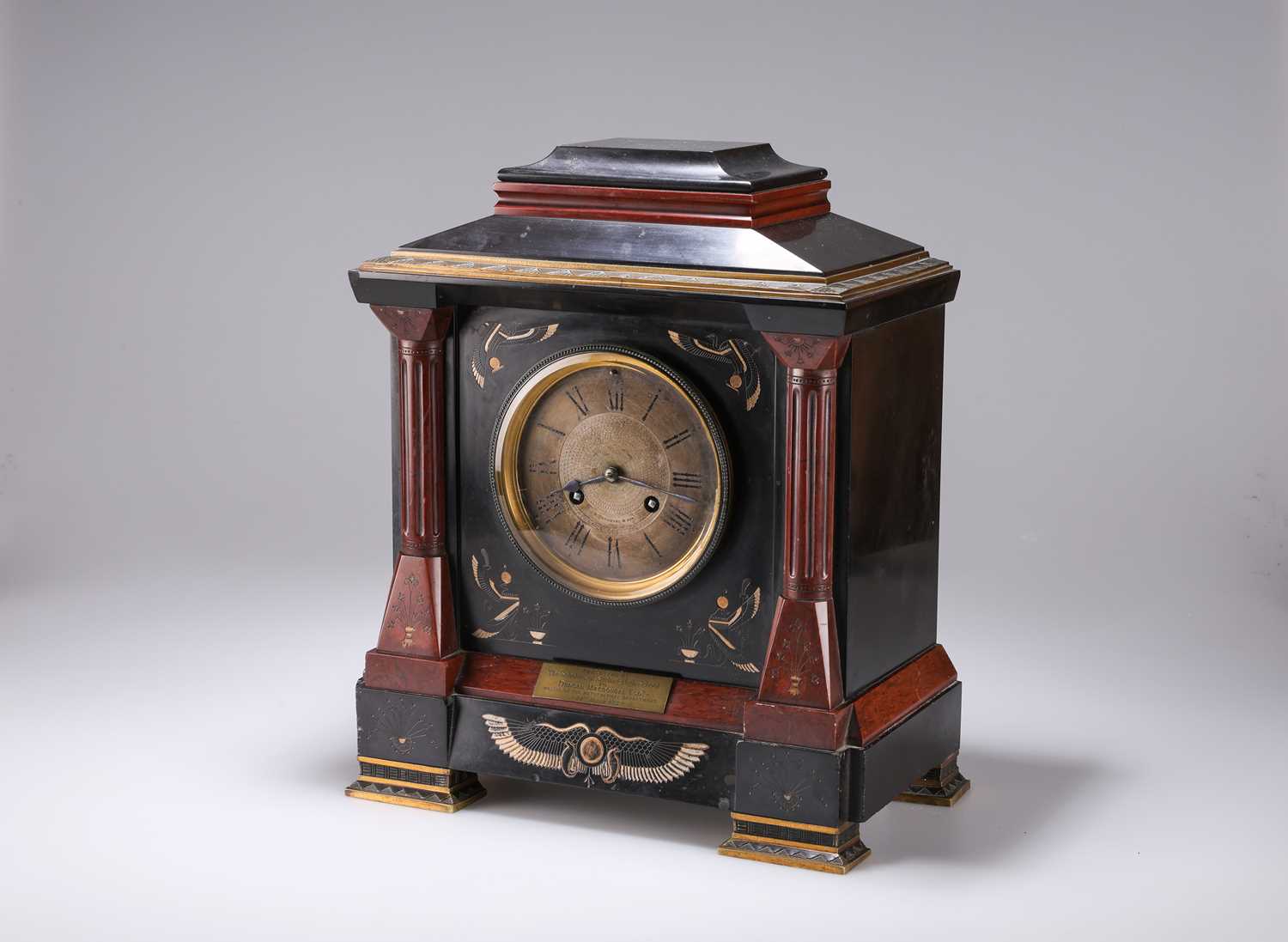 AN EGYPTIAN REVIVAL BRASS-MOUNTED, RED MARBLE AND POLISHED SLATE MANTEL CLOCK, 19TH CENTURY