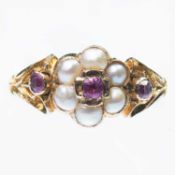 A VICTORIAN SPLIT PEARL AND GARNET CLUSTER RING