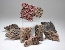 A COLLECTION OF ANTIQUE WOODEN FABRIC PRINTING BLOCKS