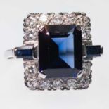 A SAPPHIRE AND DIAMOND CLUSTER RING