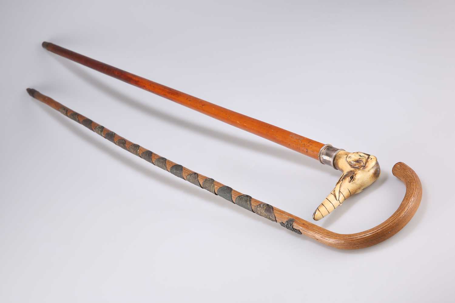 A SILVER-COLLARED AND HORN-HANDLED CANE