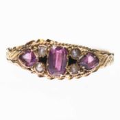 A VICTORIAN 15 CARAT GOLD GARNET AND SEED PEARL RING