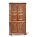 A GOOD GEORGE III YEW WOOD AND MAHOGANY BANDED OAK STANDING CORNER CUPBOARD