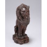 A LATE VICTORIAN OAK MODEL OF A LION