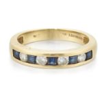 AN 18 CARAT GOLD SAPPHIRE AND DIAMOND HALF HOOP RING