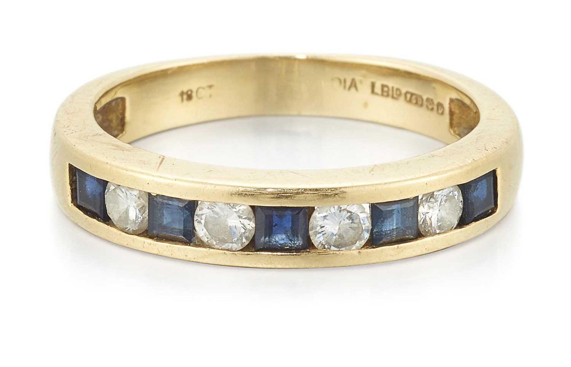 AN 18 CARAT GOLD SAPPHIRE AND DIAMOND HALF HOOP RING