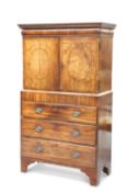 AN EARLY 18TH CENTURY WALNUT CABINET ON A LATER CHEST