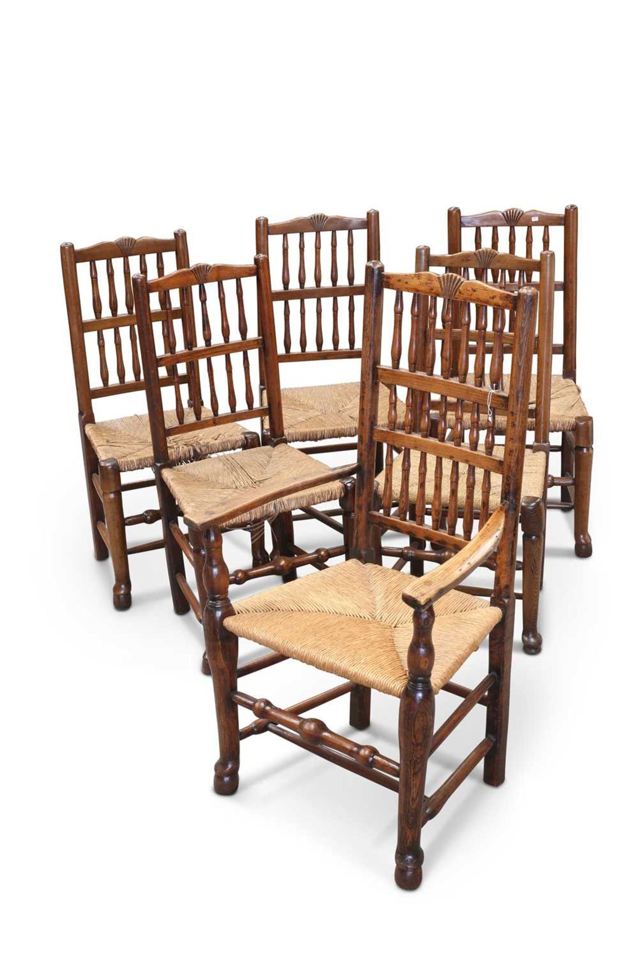 A SET OF SIX EARLY 19TH CENTURY OAK SPINDLE-BACK DINING CHAIRS, OF LANCASHIRE ORIGIN