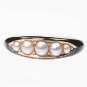 A VICTORIAN SPLIT PEARL AND ENAMEL MOURNING RING