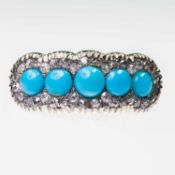 A TURQUOISE AND DIAMOND CLUSTER RING