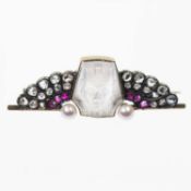 AN EARLY 20TH CENTURY EGYPTIAN REVIVAL MOONSTONE, DIAMOND, RUBY AND PEARL BROOCH